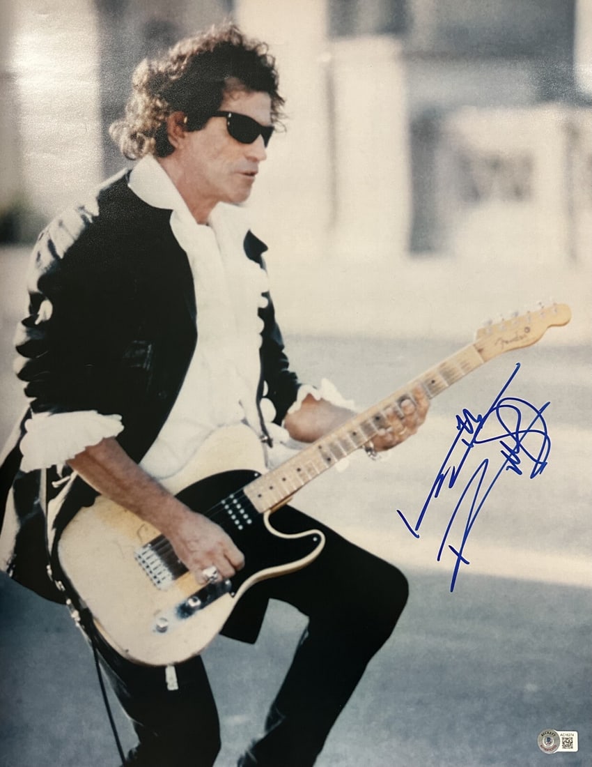 Keith Richards Signed 16x20 Photo The Rolling Stones Beckett LOA: Keith Richards Signed 16x20 Photo The Rolling Stones Beckett LOA This autographed 16x20 photograph features the legendary Keith Richards of The Rolling Stones, signed in blue permanent marker. It come