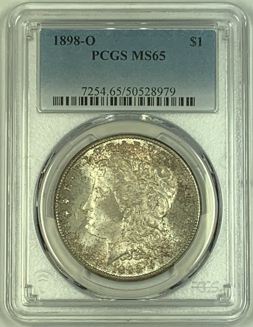 PCGS MS 65 1898-O Morgan Silver Dollar with Toning: PCGS MS 65 1898-O Morgan Silver Dollar with Toning This 1898-O Morgan Silver Dollar is an uncirculated coin graded MS 65 by PCGS. Featuring attractive toning, it was minted in the United States and is