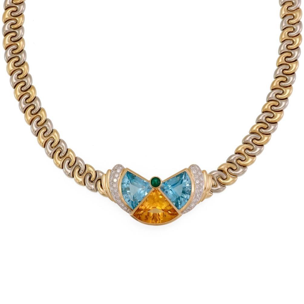 Chimento 18k Gold Diamond and Gemstone Collar Necklace: Chimento 18k Gold Diamond and Gemstone Collar Necklace This exquisite Chimento collar necklace is a stunning combination of 18k yellow and white gold. It features a unique centerpiece designed like a 