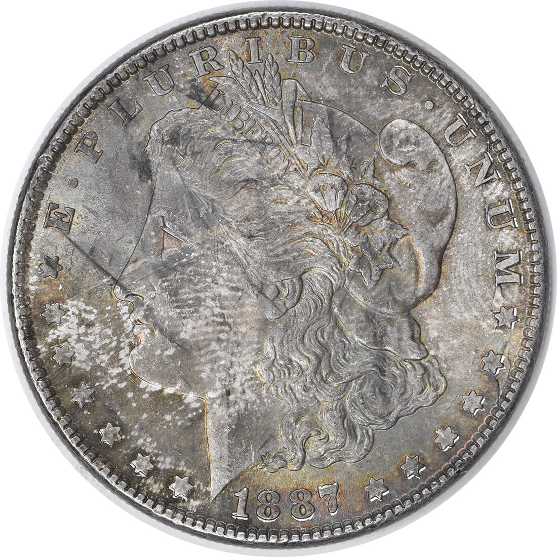 Choice BU 1887 Silver Morgan Dollar Uncertified Toned No Mint Mark: Choice BU 1887 Silver Morgan Dollar Uncertified Toned No Mint Mark This 1887 Morgan Silver Dollar features a beautiful toned appearance and is in Choice Brilliant Uncirculated condition. It is uncerti