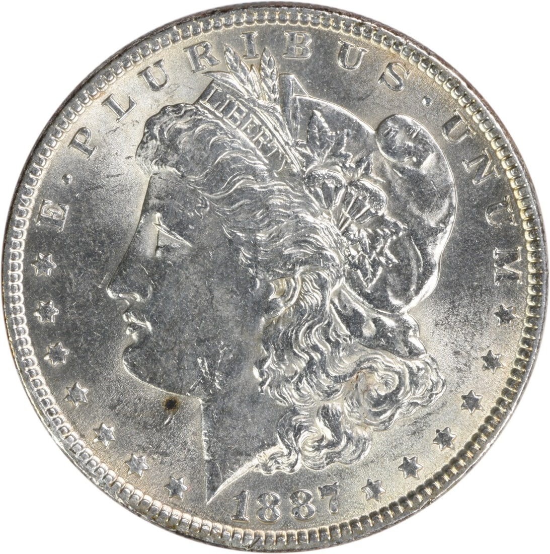 Brilliant Uncirculated 1887 Silver Dollar Morgan Type Uncertified No Mint Mark: Brilliant Uncirculated 1887 Silver Dollar Morgan Type Uncertified No Mint Mark This 1887 Morgan Silver Dollar is an uncirculated coin featuring brilliant uncirculated (BU) grade. Composed of silver, i