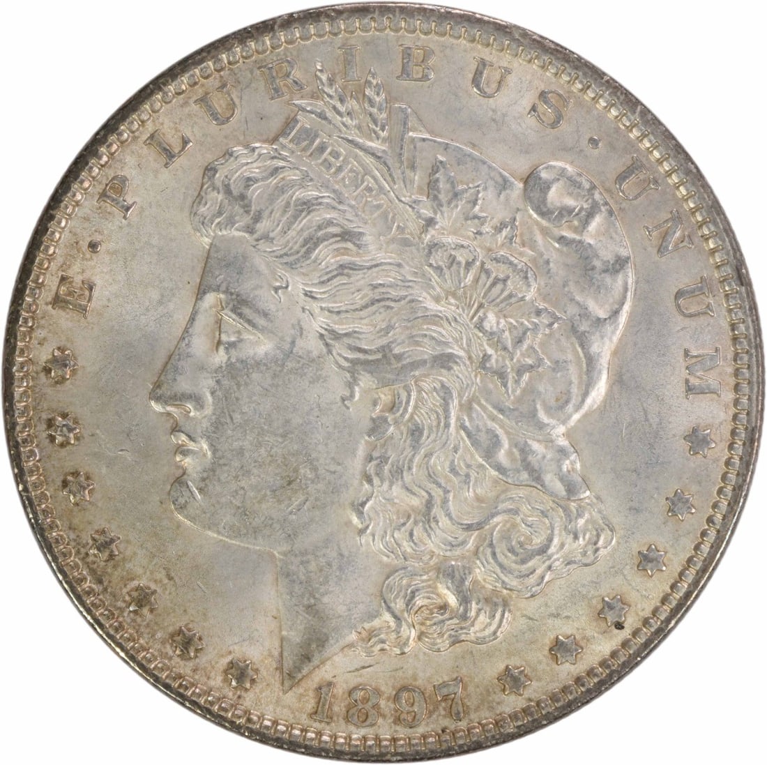 1897 Morgan Silver Dollar AU Uncertified 90% Silver Coin: 1897 Morgan Silver Dollar AU Uncertified 90% Silver Coin This 1897 Morgan Silver Dollar is an exquisite piece for any numismatic collection. It is a circulated coin, classified with an AU (Almost Unci