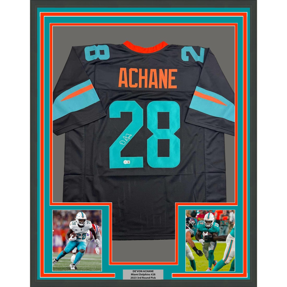 De'Von Achane Signed Miami Dolphins Framed Black Jersey 35x39 Beckett Authenticated: De'Von Achane Signed Miami Dolphins Framed Black Jersey 35x39 Beckett Authenticated This professionally framed and matted display features a Miami Dolphins black jersey autographed by De'Von Achane. T