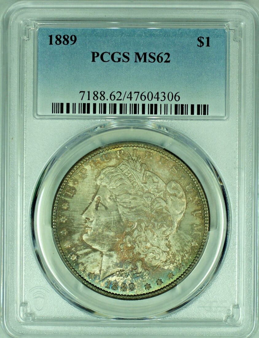PCGS MS 62+ 1889 Morgan Dollar with Toning Silver $1 Coin: PCGS MS 62+ 1889 Morgan Dollar with Toning Silver $1 Coin This 1889 Morgan Silver Dollar is certified by PCGS with a grade of MS 62+. The coin features attractive toning and remains uncirculated, maki