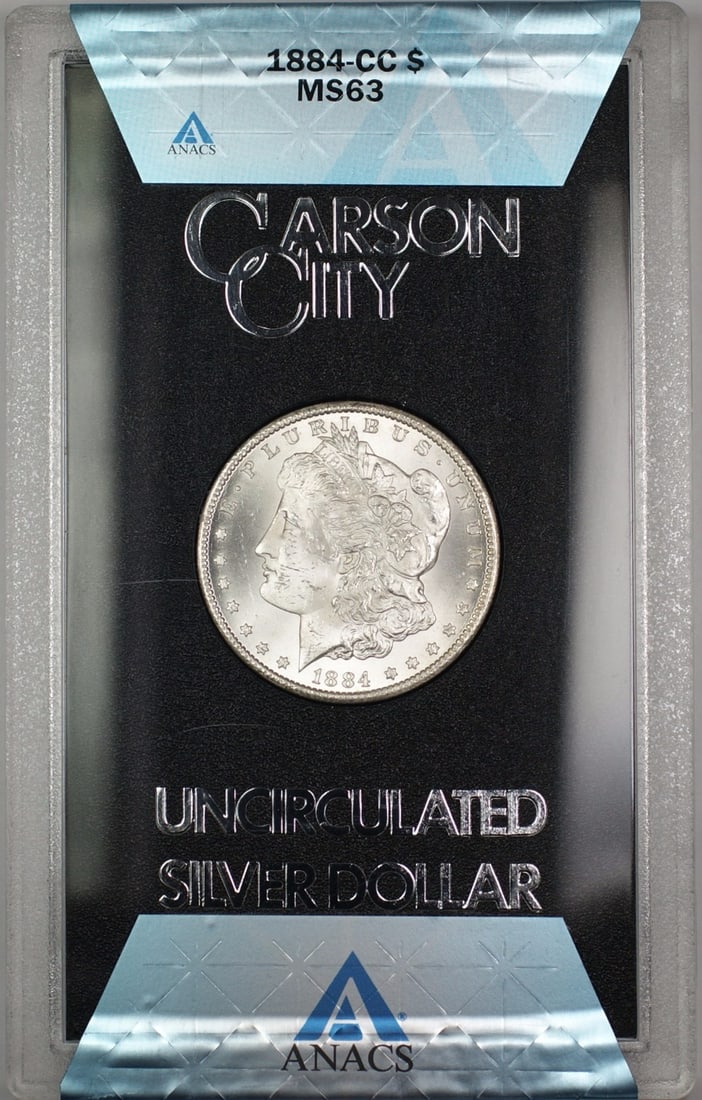 ANACS MS-63 1884-CC Morgan Dollar GSA Hoard with Box and COA: ANACS MS-63 1884-CC Morgan Dollar GSA Hoard with Box and COA This 1884-CC Morgan Silver Dollar is part of the GSA Hoard and is certified by ANACS with a grade of MS-63. The coin is uncirculated and co