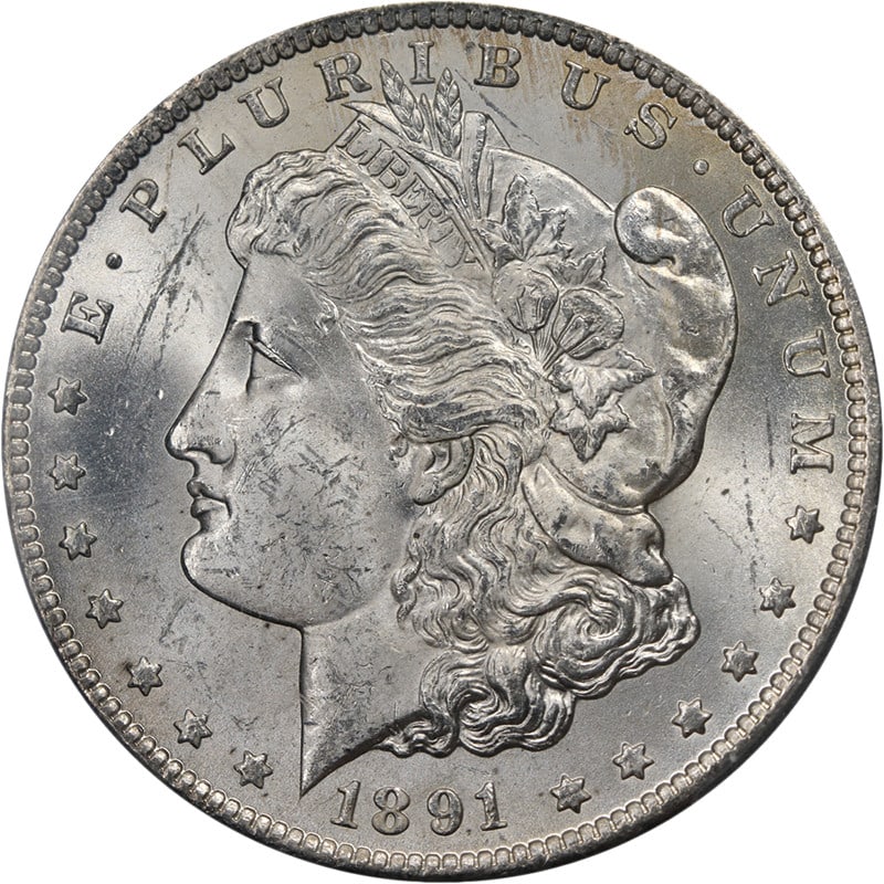 PCGS MS62 Plus 1891 Carson City Morgan Silver Dollar Uncirculated: PCGS MS62 Plus 1891 Carson City Morgan Silver Dollar Uncirculated This original 1891-CC Morgan Silver Dollar is graded PCGS MS62+ and features nice eye appeal with fantastic luster and a strong strike