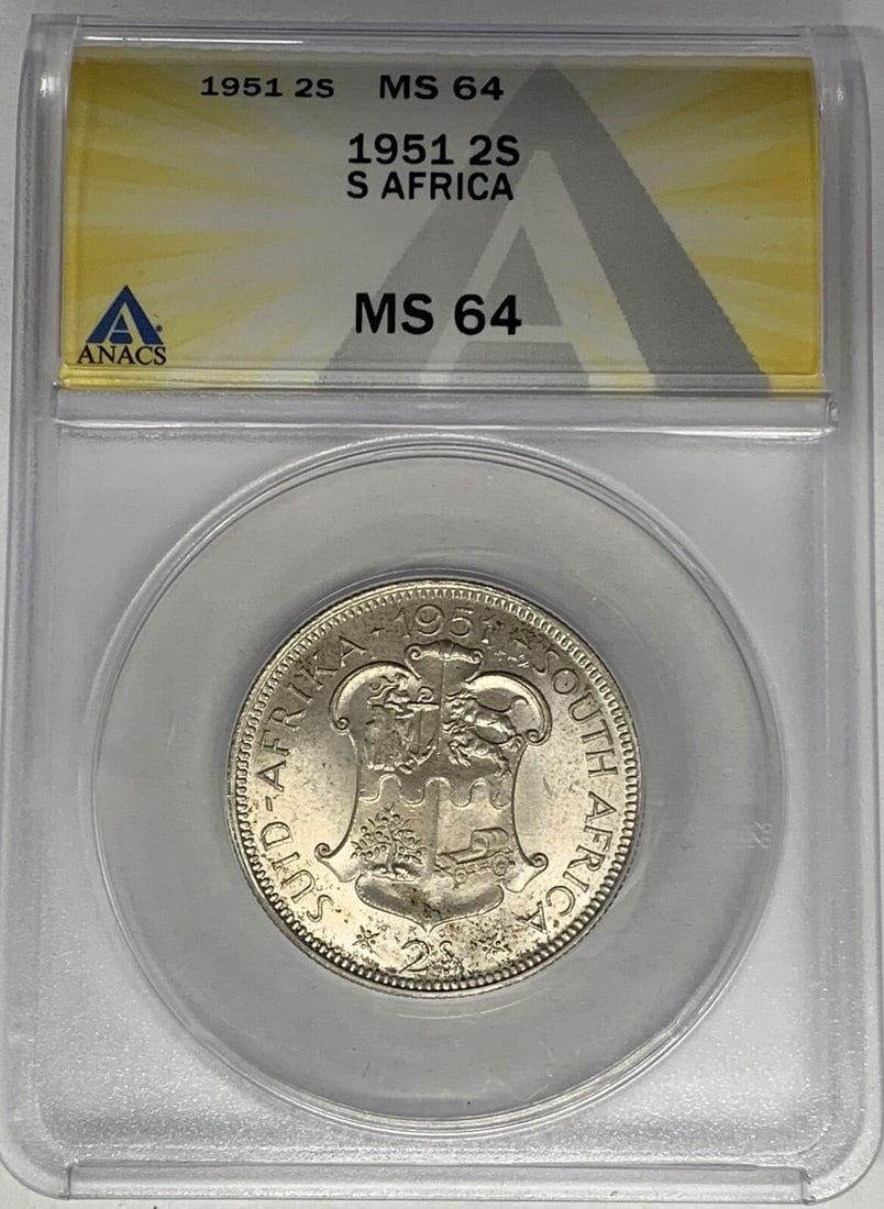 1951 Silver 2 Shillings Coin from South Africa ANACS MS 64: 1951 Silver 2 Shillings Coin from South Africa ANACS MS 64 This is a 1951 South Africa 2 Shillings coin, certified by ANACS with a grade of MS 64. The coin is uncirculated and composed of silver, repr