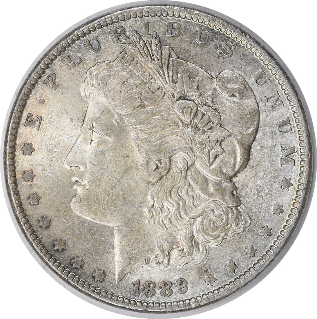 Choice BU 1889 Uncertified Morgan Dollar Silver Coin With Toning: Choice BU 1889 Uncertified Morgan Dollar Silver Coin With Toning This 1889 Morgan Silver Dollar is an uncirculated, choice brilliant uncirculated (BU) coin featuring attractive toning. Struck in silve