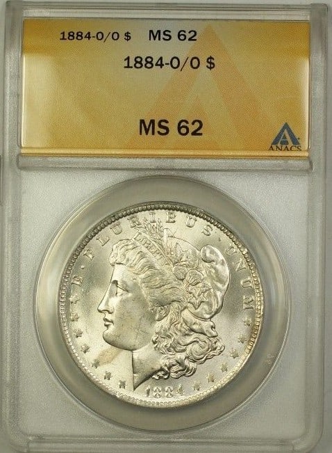 ANACS MS-62 1884-O/O Morgan Dollar Silver Coin Over Mint Mark: ANACS MS-62 1884-O/O Morgan Dollar Silver Coin Over Mint Mark This is an 1884-O/O Over Mint Mark Morgan Silver Dollar graded MS-62 by ANACS. The coin was minted in New Orleans, United States, and is c