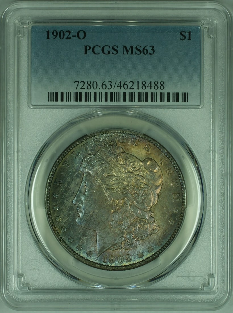 PCGS MS 63 1902 O Morgan Silver Dollar With Attractive Toning: PCGS MS 63 1902 O Morgan Silver Dollar With Attractive Toning This 1902-O Morgan Silver Dollar is graded MS-63 by PCGS and features beautiful toning. Struck at the New Orleans Mint, this uncirculated 