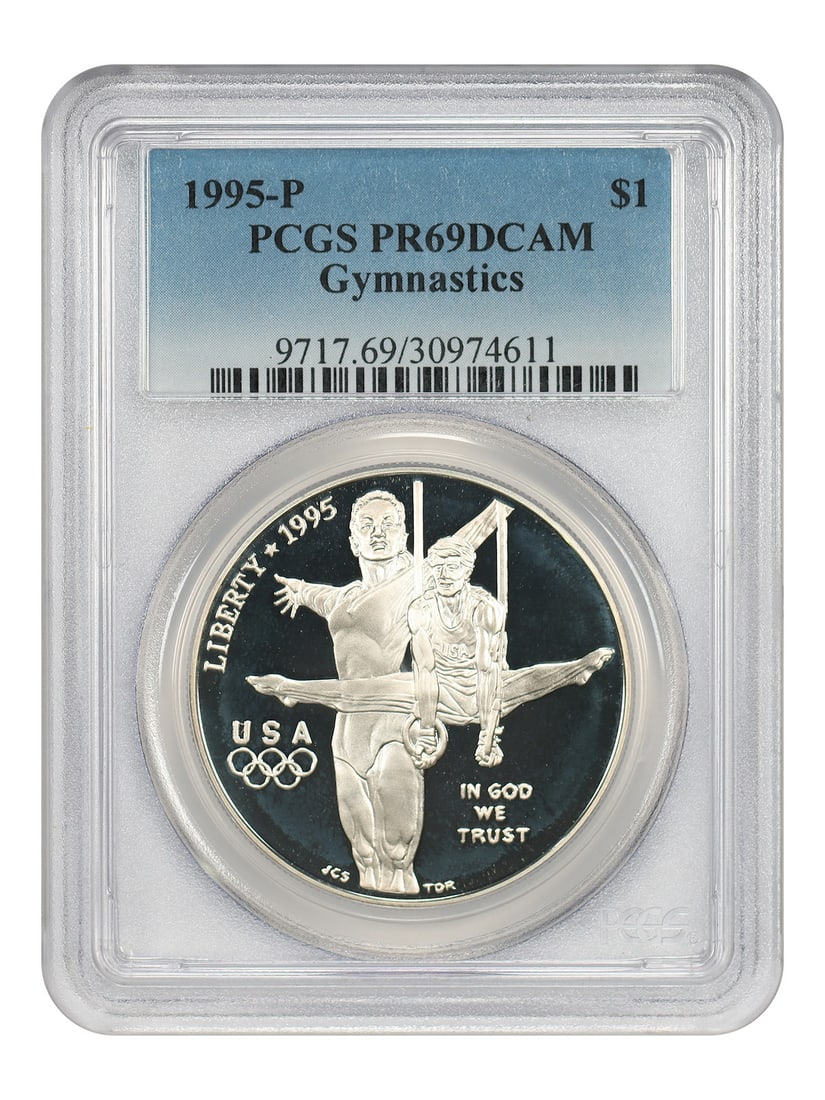 PCGS PR69DCAM 1995-P Silver $1 Gymnastics Commemorative Coin: PCGS PR69DCAM 1995-P Silver $1 Gymnastics Commemorative Coin This 1995-P $1 Gymnastics commemorative coin is a modern silver dollar struck at the Philadelphia Mint. Graded PR69 Deep Cameo (DCAM) by PC