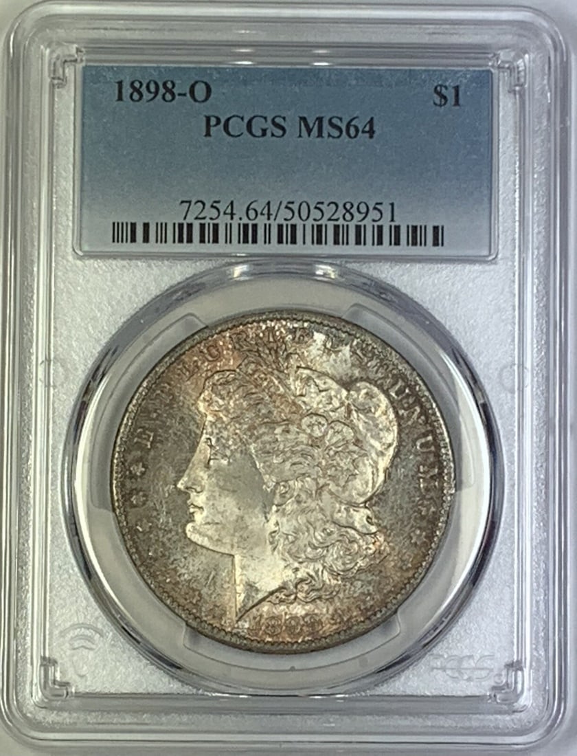PCGS MS 64 1898-O Morgan Silver Dollar with Toning: PCGS MS 64 1898-O Morgan Silver Dollar with Toning This is a 1898-O Morgan Silver Dollar graded MS 64 by PCGS. The coin features attractive toning and remains in uncirculated condition. It is composed