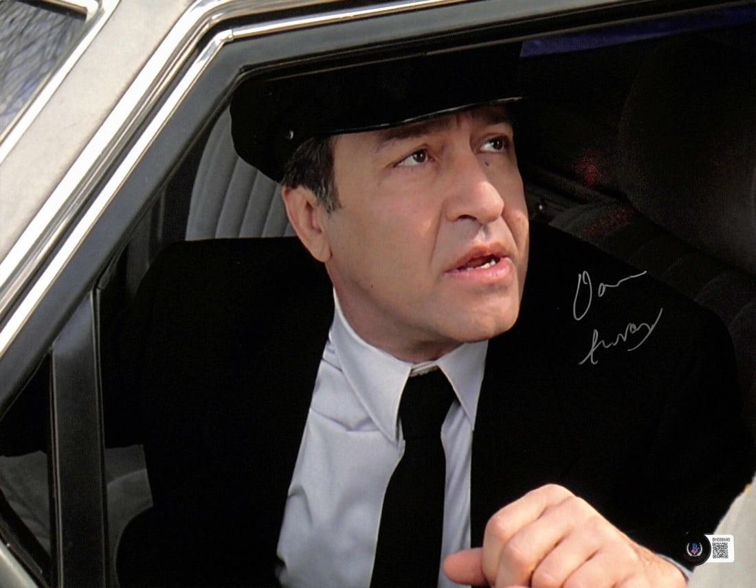 Dom Irrera Signed 11x14 Big Lebowski Photo Beckett Certified: Dom Irrera Signed 11x14 Big Lebowski Photo Beckett Certified This authentic 11x14 photograph features the signature of Dom Irrera, known for his role as "Tony the Chauffeur" in the iconic film The Big