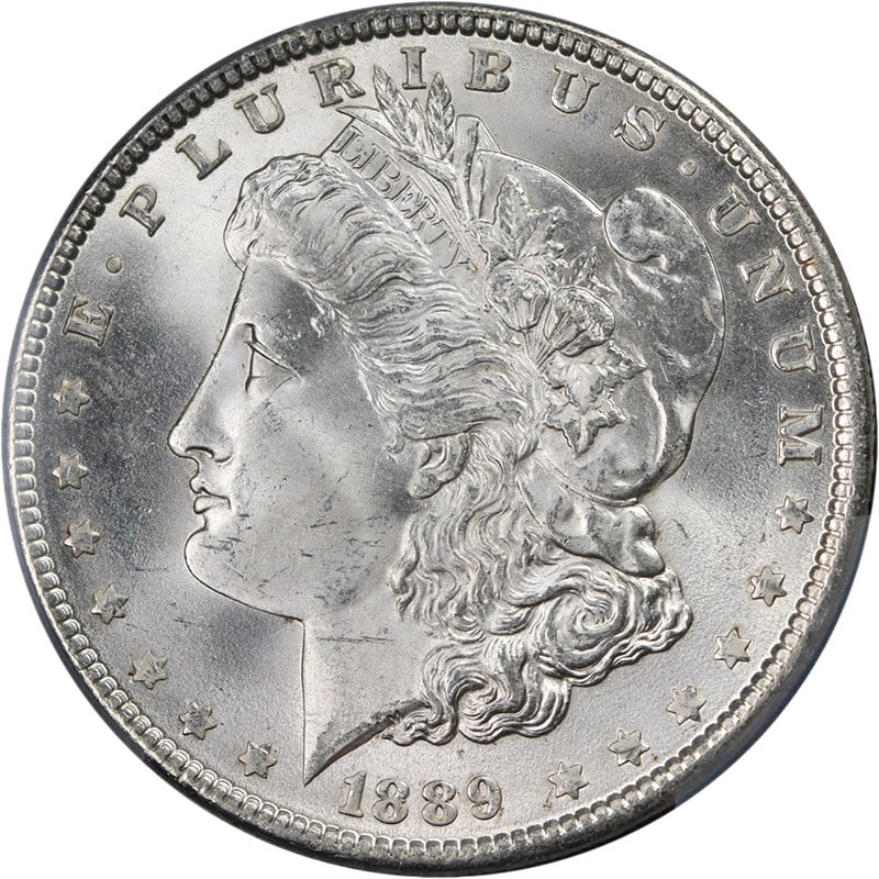 PCGS MS65 1889 Philadelphia Morgan Dollar Silver Coin Uncirculated: PCGS MS65 1889 Philadelphia Morgan Dollar Silver Coin Uncirculated This 1889-P Morgan Silver Dollar is graded MS65 by PCGS and features a brilliant blast white appearance with excellent luster and a s