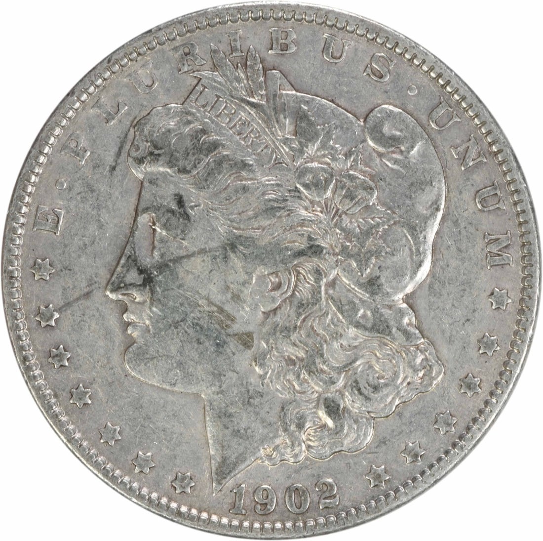 1902 Morgan Silver Dollar EF Uncertified 90% Silver Coin: 1902 Morgan Silver Dollar EF Uncertified 90% Silver Coin This 1902 Morgan Silver Dollar is a remarkable example of American coinage, showcasing the artistry of designer George T. Morgan. This coin fea
