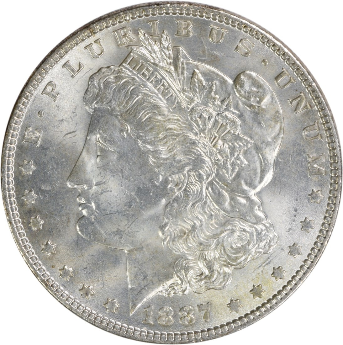 Uncirculated 1887 Silver Dollar Morgan BU Philadelphia No Mint Mark: Uncirculated 1887 Silver Dollar Morgan BU Philadelphia No Mint Mark This is an uncirculated 1887 Morgan Silver Dollar from the United States. The coin has a Brilliant Uncirculated (BU) grade and does 