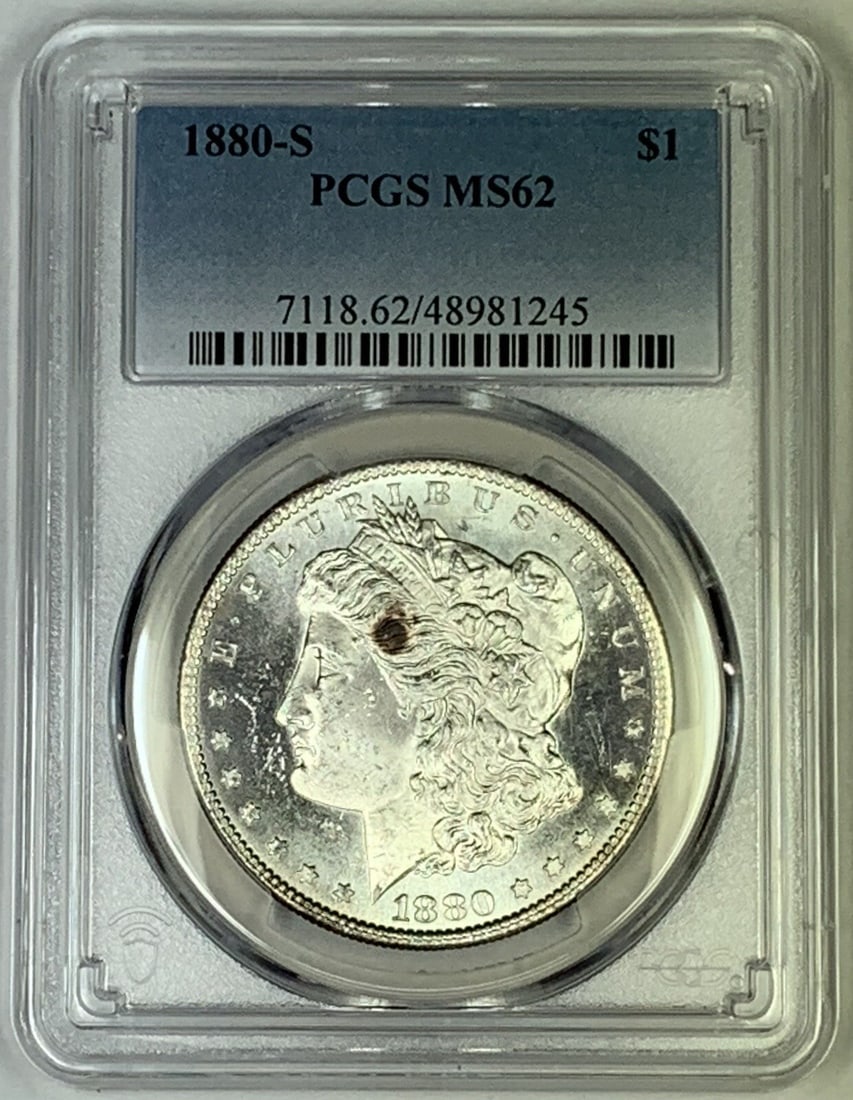 PCGS MS 62 1880-S Morgan Silver Dollar Semi-PL Certified Coin: PCGS MS 62 1880-S Morgan Silver Dollar Semi-PL Certified Coin This is an uncirculated 1880-S Morgan Silver Dollar coin graded MS 62 by PCGS. The coin is composed of silver and features a semi-prooflik