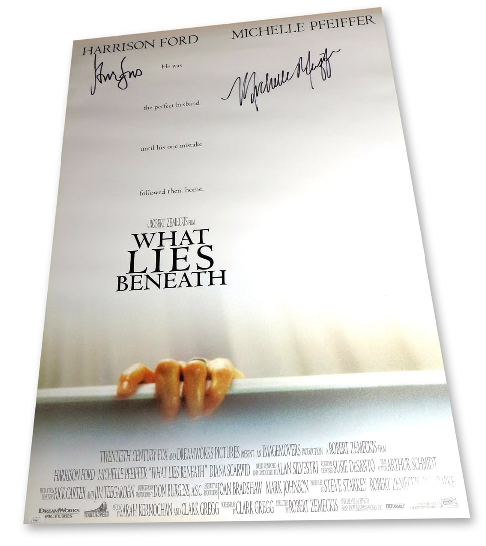 Harrison Ford Michelle Pfeiffer Autographed 27X40 Poster JSA Authenticated: Harrison Ford Michelle Pfeiffer Autographed 27X40 Poster JSA Authenticated This original 27x40 poster of 'What Lies Beneath' features the autographs of acclaimed actors Harrison Ford and Michelle Pfei