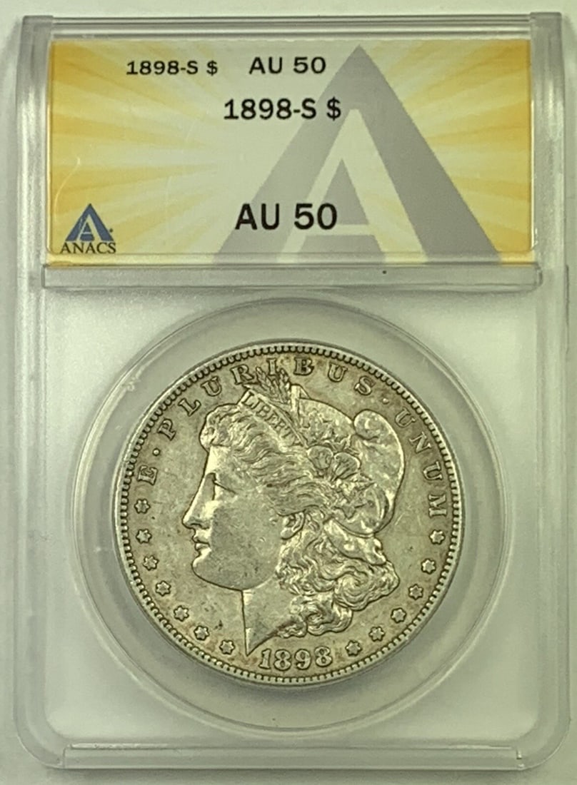 ANACS AU 50 Graded 1898-S Morgan Silver Dollar United States $1 Coin: ANACS AU 50 Graded 1898-S Morgan Silver Dollar United States $1 Coin This is an 1898-S Morgan Silver Dollar with a denomination of $1, certified by ANACS with a grade of AU 50. The coin is composed of
