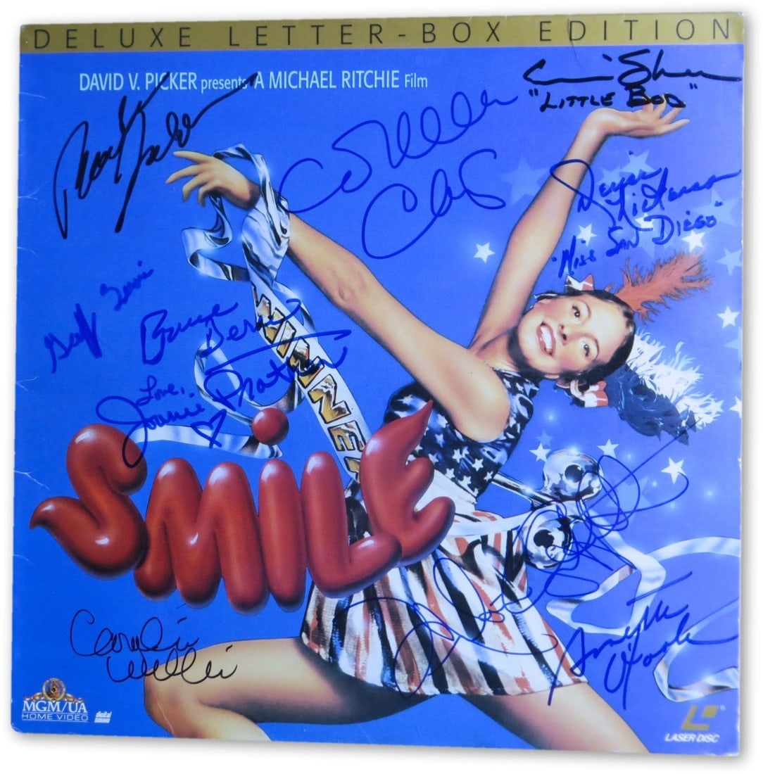 Smile Cast Autographed Laserdisc Cover 10 Signatures JSA: Smile Cast Autographed Laserdisc Cover 10 Signatures JSA This unique item features a signed laserdisc cover from the film "Smile," autographed by a total of 10 cast members, including Melanie Griffith