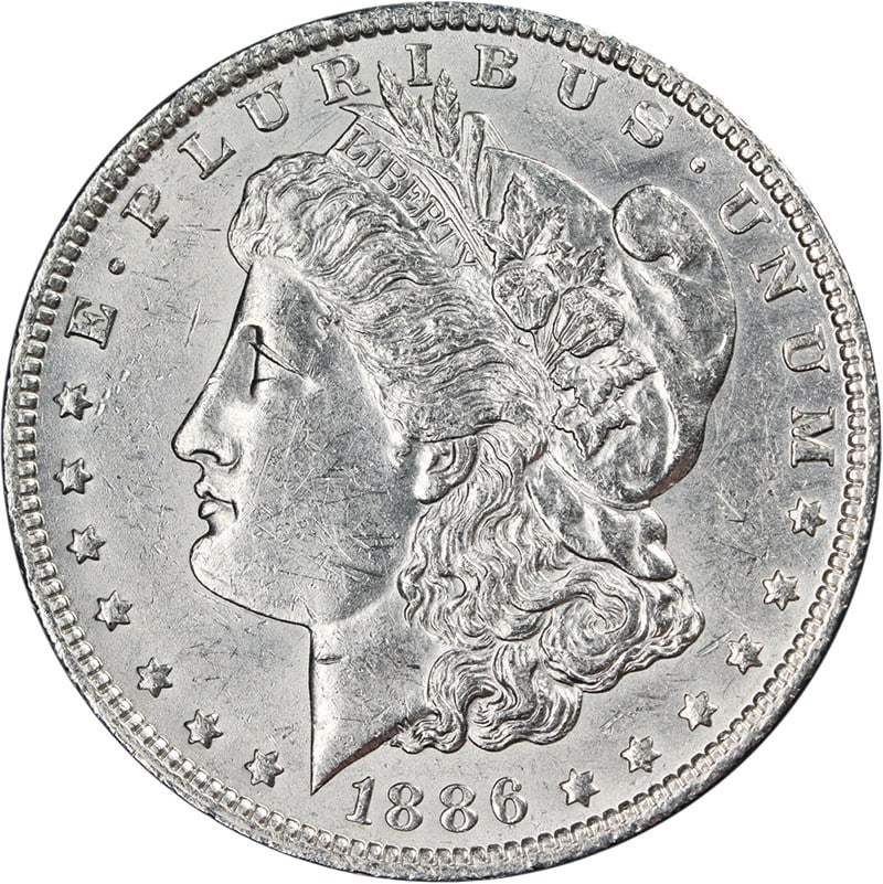 AU or BU 1886-O Silver Dollar with Strong Strike and Attractive Luster: AU or BU 1886-O Silver Dollar with Strong Strike and Attractive Luster This 1886-O Morgan Silver Dollar features attractive luster, a strong strike, and bright white surfaces. The coin displays pleasi