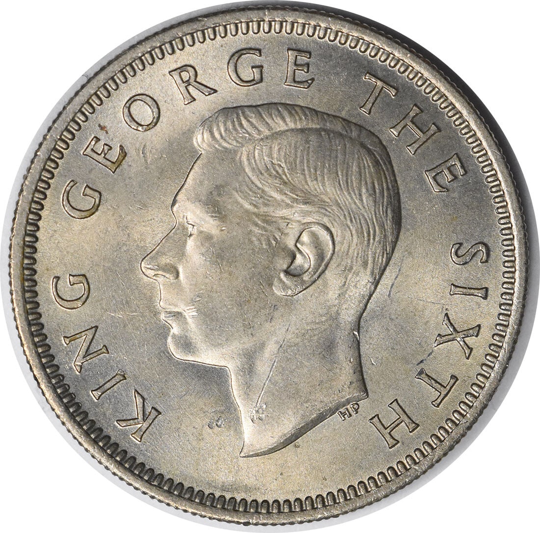 Uncirculated 1951 One Shilling Coin From New Zealand KM17 Uncertified: Uncirculated 1951 One Shilling Coin From New Zealand KM17 Uncertified This 1951 New Zealand 1 Shilling coin is in uncirculated condition. It is uncertified and originates from New Zealand. The coin is