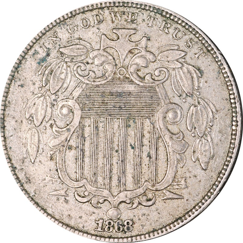 United States 1868 Nickel Shield Five Cent Piece Circulated: United States 1868 Nickel Shield Five Cent Piece Circulated This is an 1868 Shield Nickel from the United States. The coin is composed of nickel and is in circulated, pre-owned condition. It is uncert