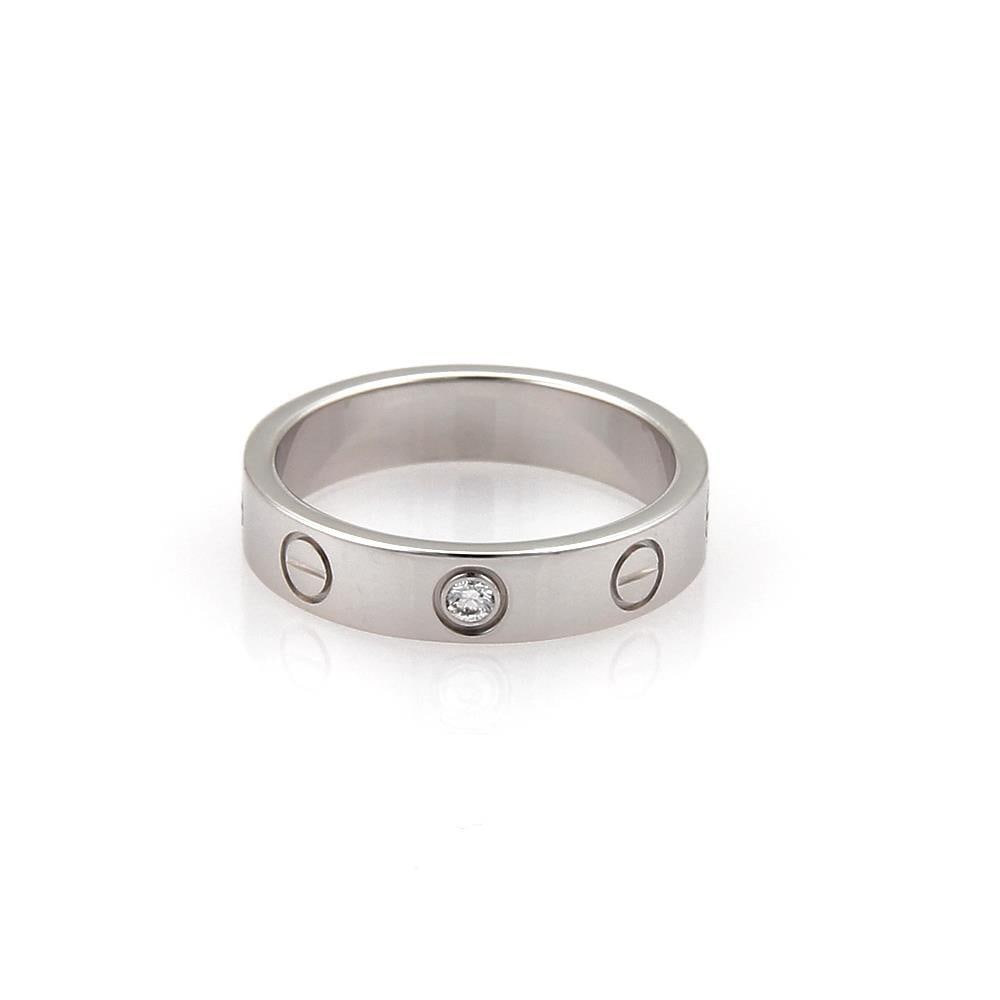 Cartier Mini Love Diamond Band Ring 18k White Gold Size US 4: Cartier Mini Love Diamond Band Ring 18k White Gold Size US 4 Explore the elegance of the Cartier Mini Love 1 Diamond Band Ring, a stunning piece from the renowned MINI LOVE collection. Crafted from lu