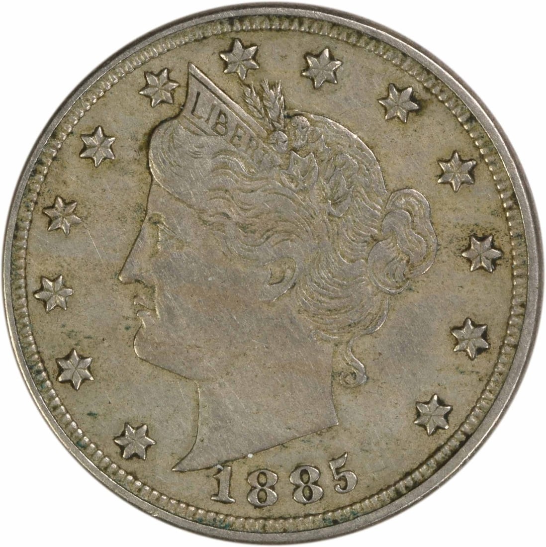 1885 United States Liberty Nickel Five Cent Coin EF Grade Uncertified: 1885 United States Liberty Nickel Five Cent Coin EF Grade Uncertified This is an 1885 Liberty Nickel from the United States, featuring the design by Charles E. Barber. The coin is circulated and in Ex