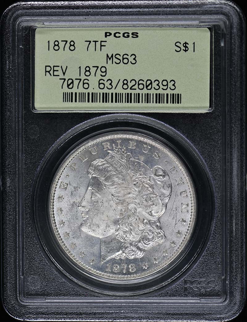 1878 Morgan Dollar Reverse of 1879 PCGS MS63 Uncirculated: 1878 Morgan Dollar Reverse of 1879 PCGS MS63 Uncirculated This 1878 Morgan Dollar is graded MS63 by PCGS, ensuring its uncirculated condition. Struck at the Philadelphia mint, this coin showcases the 