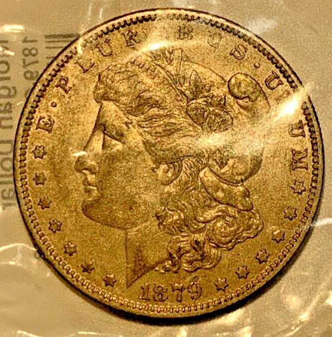 1879-O Morgan Dollar Silver Coin from New Orleans XF to EF: 1879-O Morgan Dollar Silver Coin from New Orleans XF to EF This 1879-O Morgan Silver Dollar is a pre-owned, circulated coin minted in New Orleans. It is composed of silver and has an XF/EF (Extra Fine