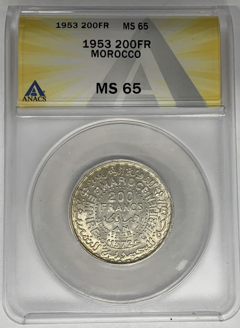 ANACS MS 65 Silver 1953 Morocco 20 Francs Uncirculated Coin: ANACS MS 65 Silver 1953 Morocco 20 Francs Uncirculated Coin This is a 1953 Morocco 20 Francs coin composed of silver. It is certified by ANACS with a grade of MS 65, indicating it is in uncirculated c