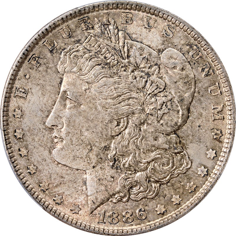 PCGS MS63 1886 Morgan Dollar Philadelphia Silver Toned Uncirculated: PCGS MS63 1886 Morgan Dollar Philadelphia Silver Toned Uncirculated This 1886 Morgan Silver Dollar was minted in Philadelphia and features attractive toning. Certified by PCGS with a grade of MS63, th