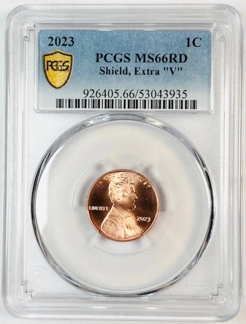PCGS MS66 Red 2023 Shield Cent with Extra V Variety: PCGS MS66 Red 2023 Shield Cent with Extra V Variety This 2023 Lincoln penny features the shield reverse design and an extra "V" detail. Graded MS-66 Red by PCGS, it is composed of copper and remains u