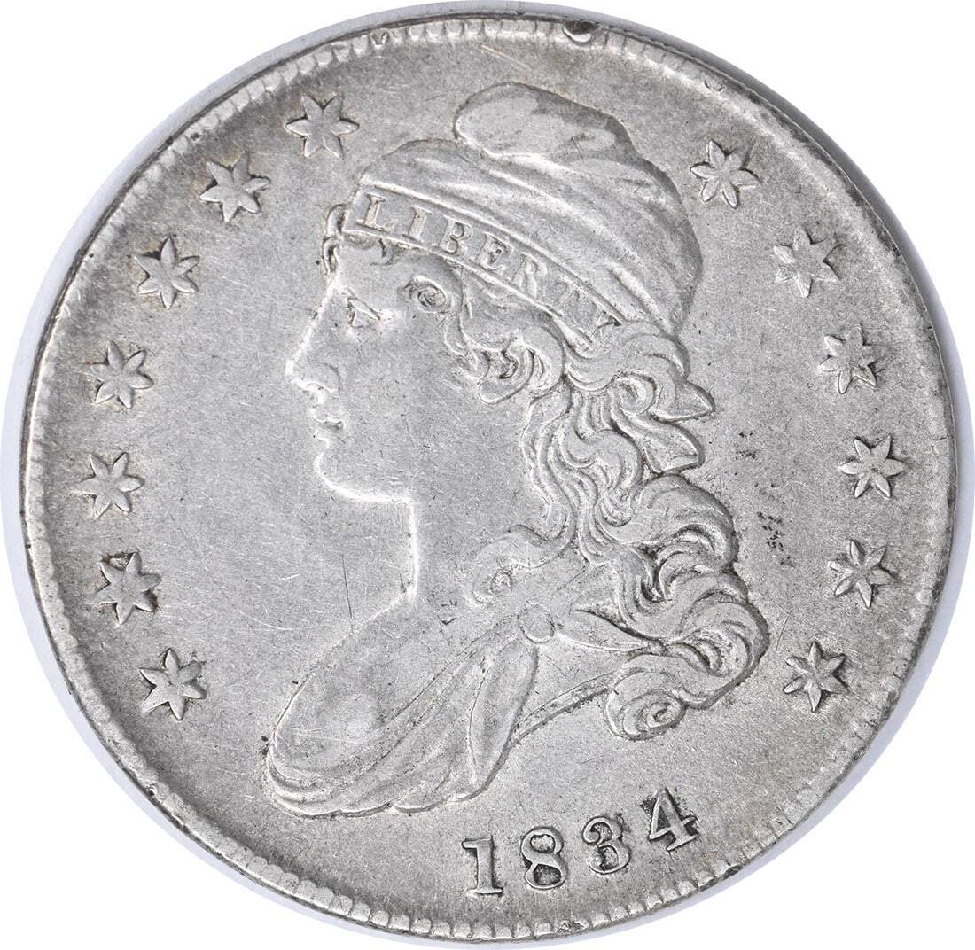 1834 Bust Half Dollar Large Date by John Reich Uncertified: 1834 Bust Half Dollar Large Date by John Reich Uncertified This 1834 Bust Half Dollar features a large date and large letters, showcasing the intricate design by John Reich. Crafted in Philadelphia, t
