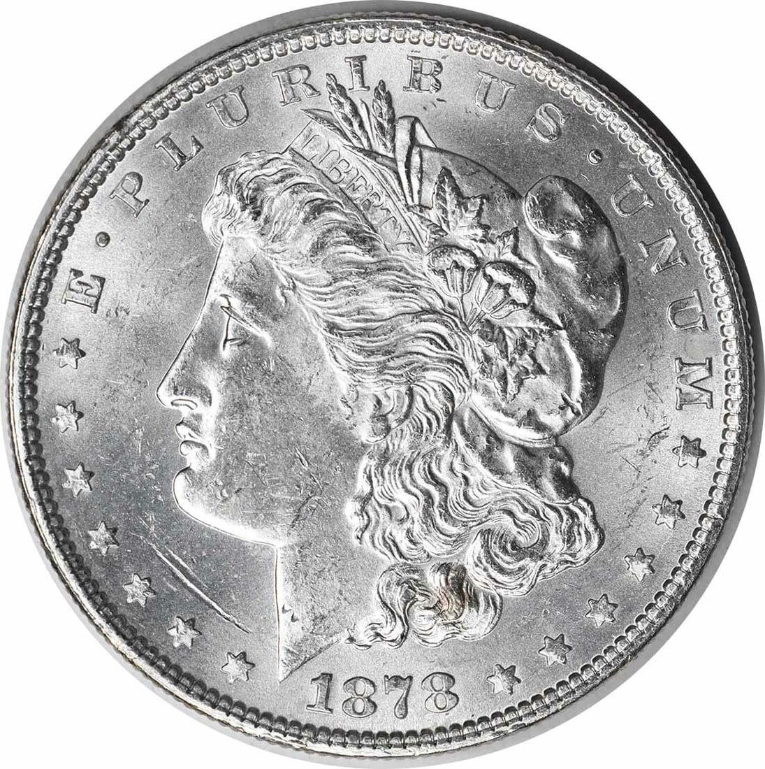Choice BU 1878 Silver Dollar 7 Tail Feathers Reverse Uncertified: Choice BU 1878 Silver Dollar 7 Tail Feathers Reverse Uncertified This is an 1878 Morgan Silver Dollar featuring the 7 Tail Feathers Reverse of 1878. The coin is uncirculated and graded as Choice Brill
