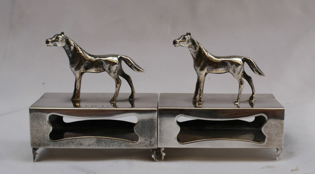 Pair of 1900 Sterling Silver Horse Motif Match Strikers Georgian Pattern: Pair of 1900 Sterling Silver Horse Motif Match Strikers Georgian Pattern This set includes two sterling silver match strikes from the 1900s, each featuring a finely detailed horse motif. Both pieces a