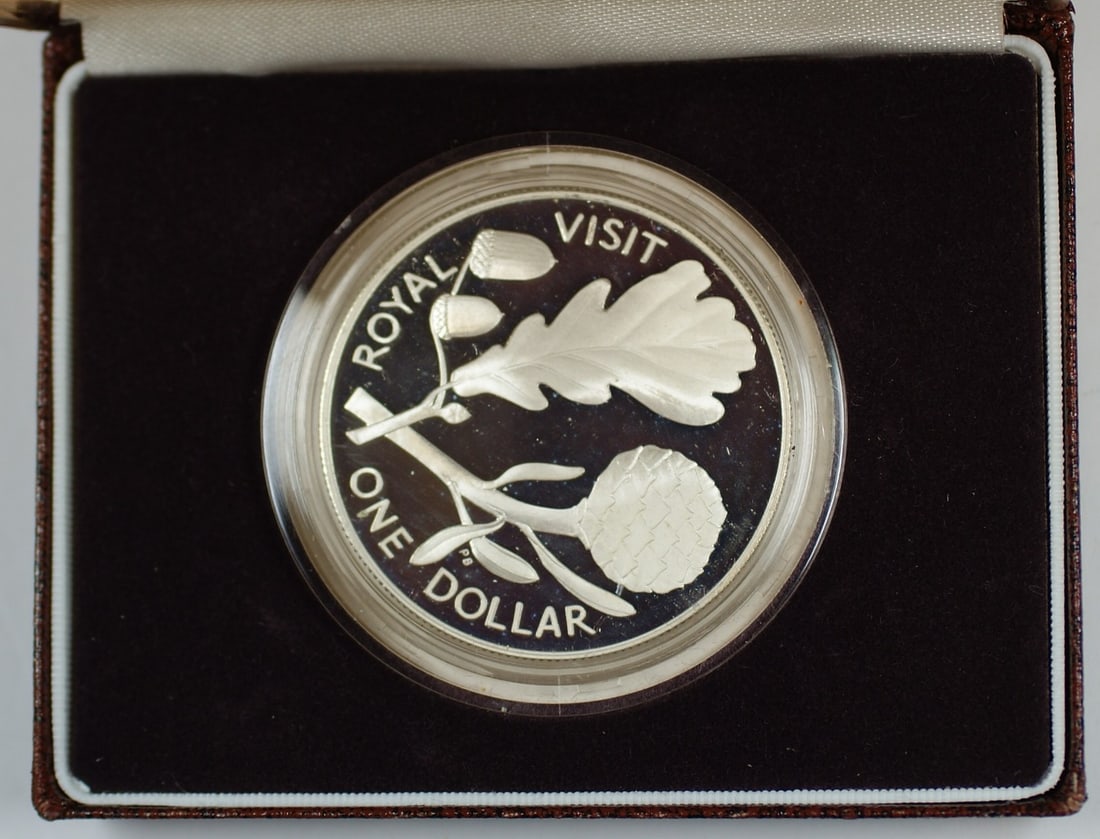 1981 Proof Silver Dollar Royal Visit New Zealand With Case: 1981 Proof Silver Dollar Royal Visit New Zealand With Case This is a 1981 New Zealand proof sterling silver dollar, issued to commemorate the Royal Visit to New Zealand. Struck at the Royal Mint, this