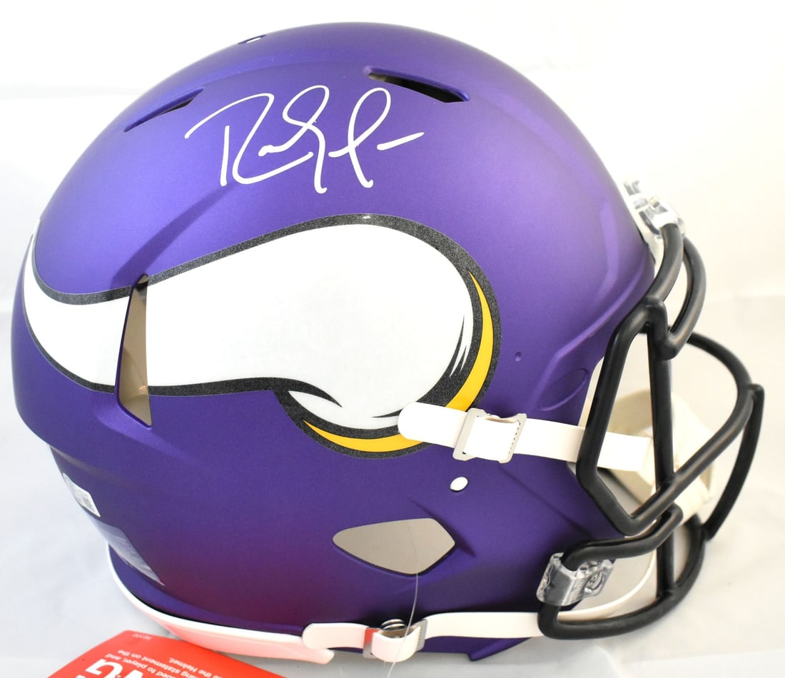 Minnesota Vikings Speed Helmet Signed by Randy Moss Beckett Authenticated: Minnesota Vikings Speed Helmet Signed by Randy Moss Beckett Authenticated This is a pre-owned Minnesota Vikings full-size Speed Authentic helmet, autographed by Randy Moss. The helmet is an original p