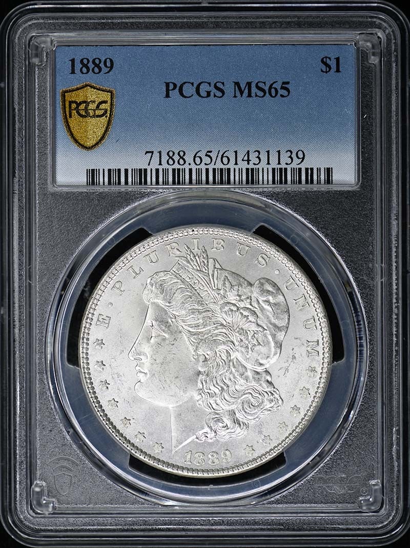 PCGS MS65 1889 Morgan Silver Dollar Philadelphia Mint: PCGS MS65 1889 Morgan Silver Dollar Philadelphia Mint This 1889 Morgan Dollar is certified by PCGS with a grade of MS65, indicating an uncirculated coin in excellent condition. Minted in Philadelphia,