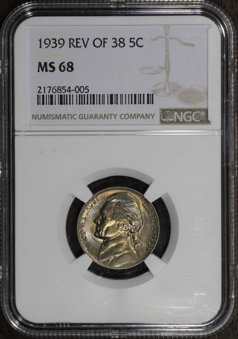 1939 Jefferson 5 Cent Coin MS68 NGC Reverse 1938 With Rainbow Toning: 1939 Jefferson 5 Cent Coin MS68 NGC Reverse 1938 With Rainbow Toning This 1939 Jefferson Nickel features the Reverse of 1938 and displays attractive rainbow toning. Graded MS68 by NGC, this uncirculat
