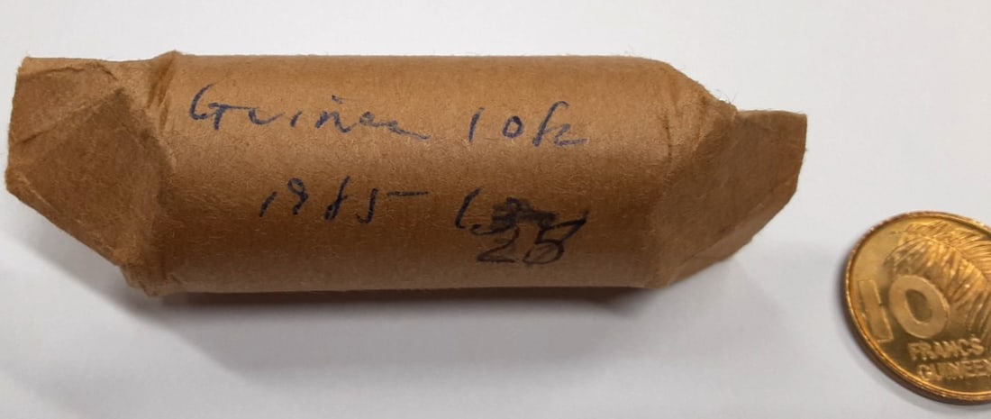 Roll of 25 Uncirculated 1985 Guinea 10 Francs Brass Clad Steel Coins KM#52: Roll of 25 Uncirculated 1985 Guinea 10 Francs Brass Clad Steel Coins KM#52 This is a roll of 25 un-used 1985 Republic of Guinea 10 Francs coins, KM#52. Each coin is made of brass clad steel and remain