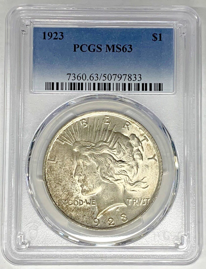 1923 Peace Dollar Silver Coin PCGS MS 63 Light Toning: 1923 Peace Dollar Silver Coin PCGS MS 63 Light Toning This is a 1923 Peace Silver Dollar coin, lightly toned and certified by PCGS with a grade of MS 63. The coin is uncirculated and composed of silve