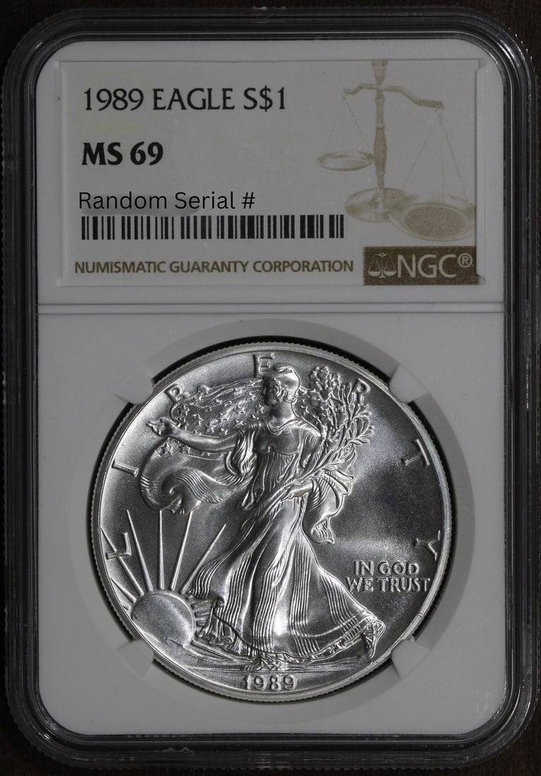 1989 NGC MS69 American Eagle Silver Dollar 1 oz Coin: 1989 NGC MS69 American Eagle Silver Dollar 1 oz Coin This 1989 American Silver Eagle $1 coin is composed of 0.999 fine silver and contains 1 troy ounce of precious metal. Graded MS69 by NGC, it is iss