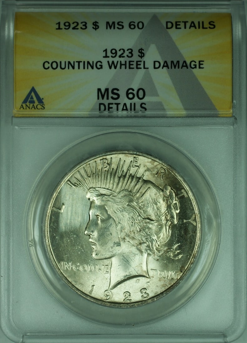 1923 ANACS MS-60 Peace Silver Dollar With Wheel Damage: 1923 ANACS MS-60 Peace Silver Dollar With Wheel Damage This is a 1923 Peace Silver Dollar from the United States, certified by ANACS with a grade of MS-60 Details. The coin is composed of silver, has 