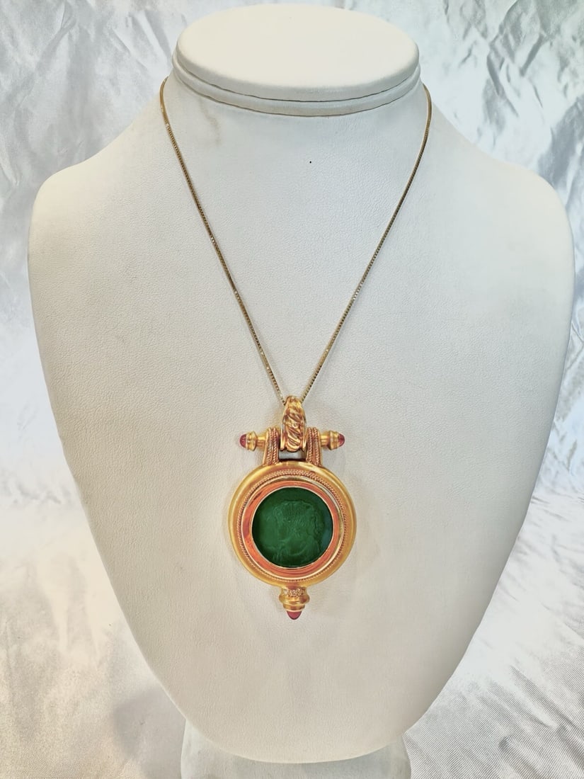 JBL 18k Gold Diamond Tourmaline Chalcedony Pendant Necklace: JBL 18k Gold Diamond Tourmaline Chalcedony Pendant Necklace This exquisite necklace showcases a stunning pendant crafted from 18k yellow gold, featuring a beautiful green chalcedony intaglio at its ce