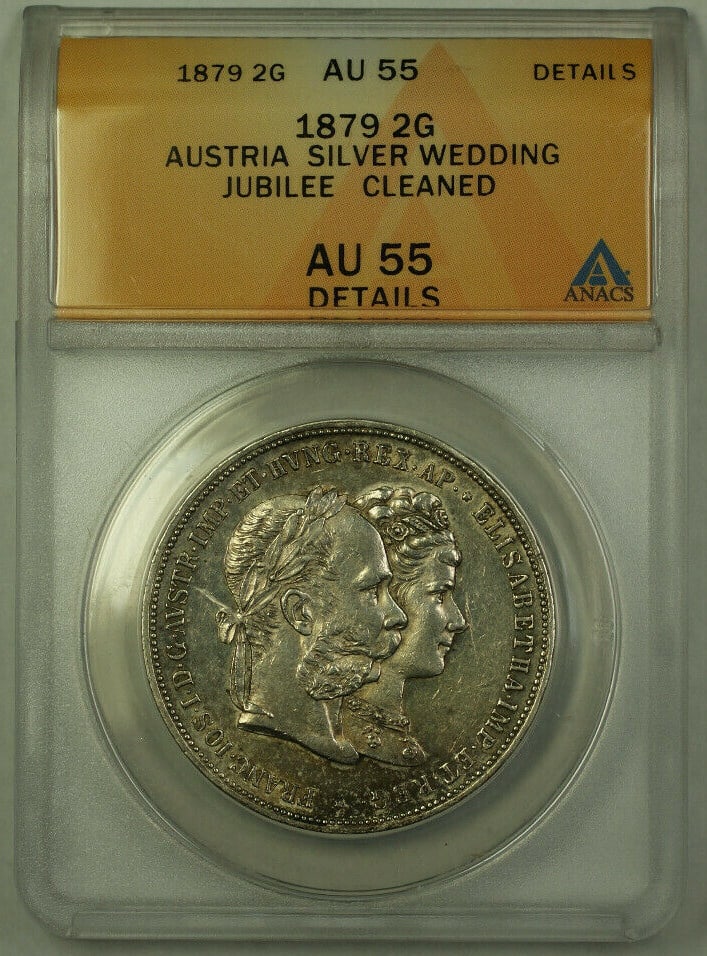 Austria 1879 2 Gulden Silver Wedding Jubilee Coin ANACS AU-55: Austria 1879 2 Gulden Silver Wedding Jubilee Coin ANACS AU-55 This 1879 Austria 2 Gulden silver coin commemorates the Wedding Jubilee and is certified by ANACS with an AU-55 Details grade. The coin is