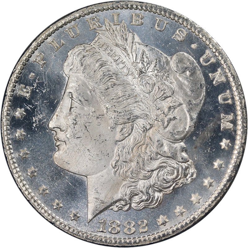 NGC MS63 PL 1882-CC Morgan Silver Dollar GSA Holder: NGC MS63 PL 1882-CC Morgan Silver Dollar GSA Holder This 1882-CC GSA Morgan Silver Dollar is certified by NGC with a grade of MS63 PL. Struck at the Carson City Mint, it features a blast white appeara