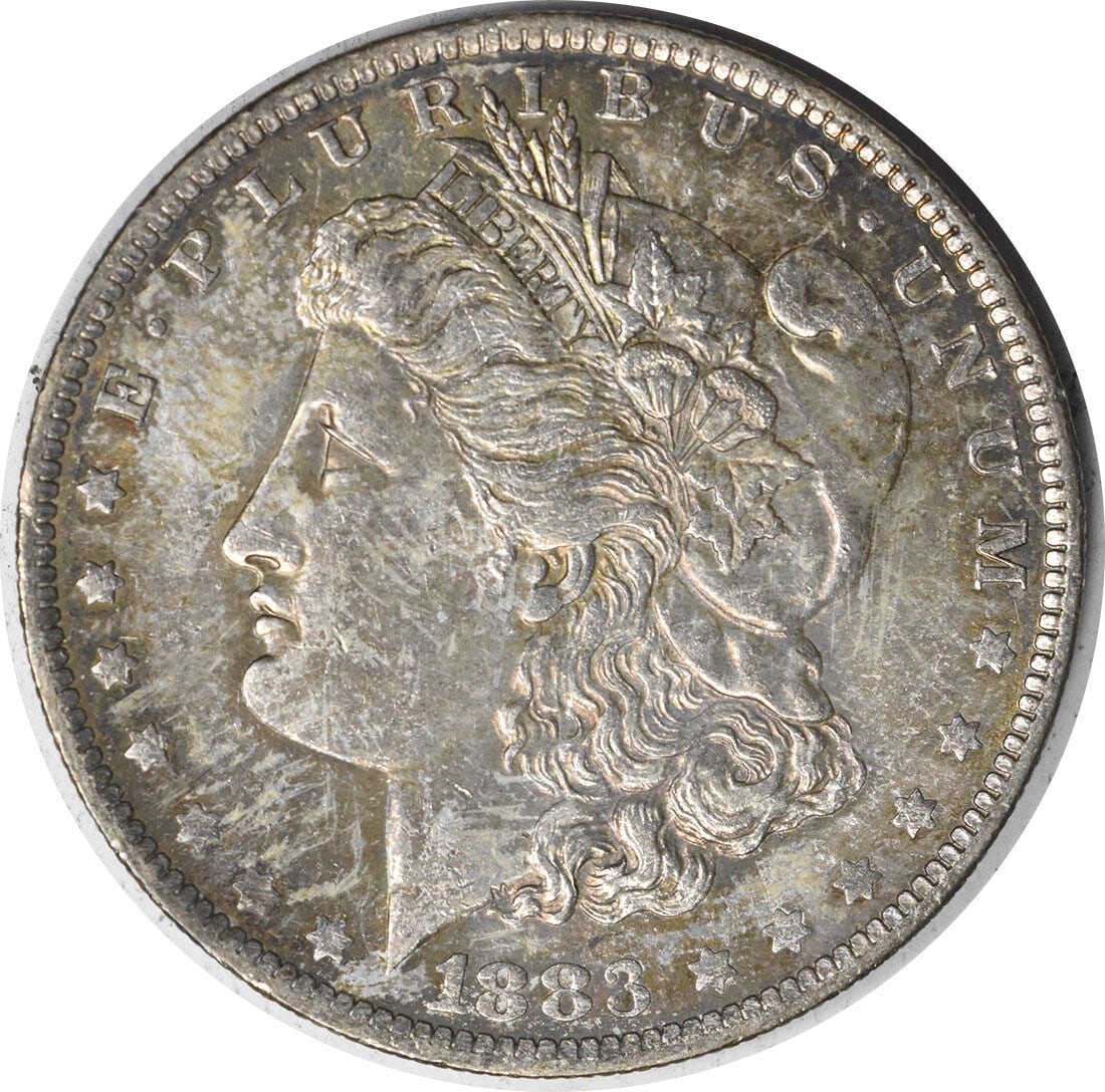 Uncirculated 1883-O Morgan Dollar Silver Coin Choice BU With Attractive Toning: Uncirculated 1883-O Morgan Dollar Silver Coin Choice BU With Attractive Toning This is an 1883-O Morgan Silver Dollar featuring attractive toning. The coin is in uncirculated condition and graded as C