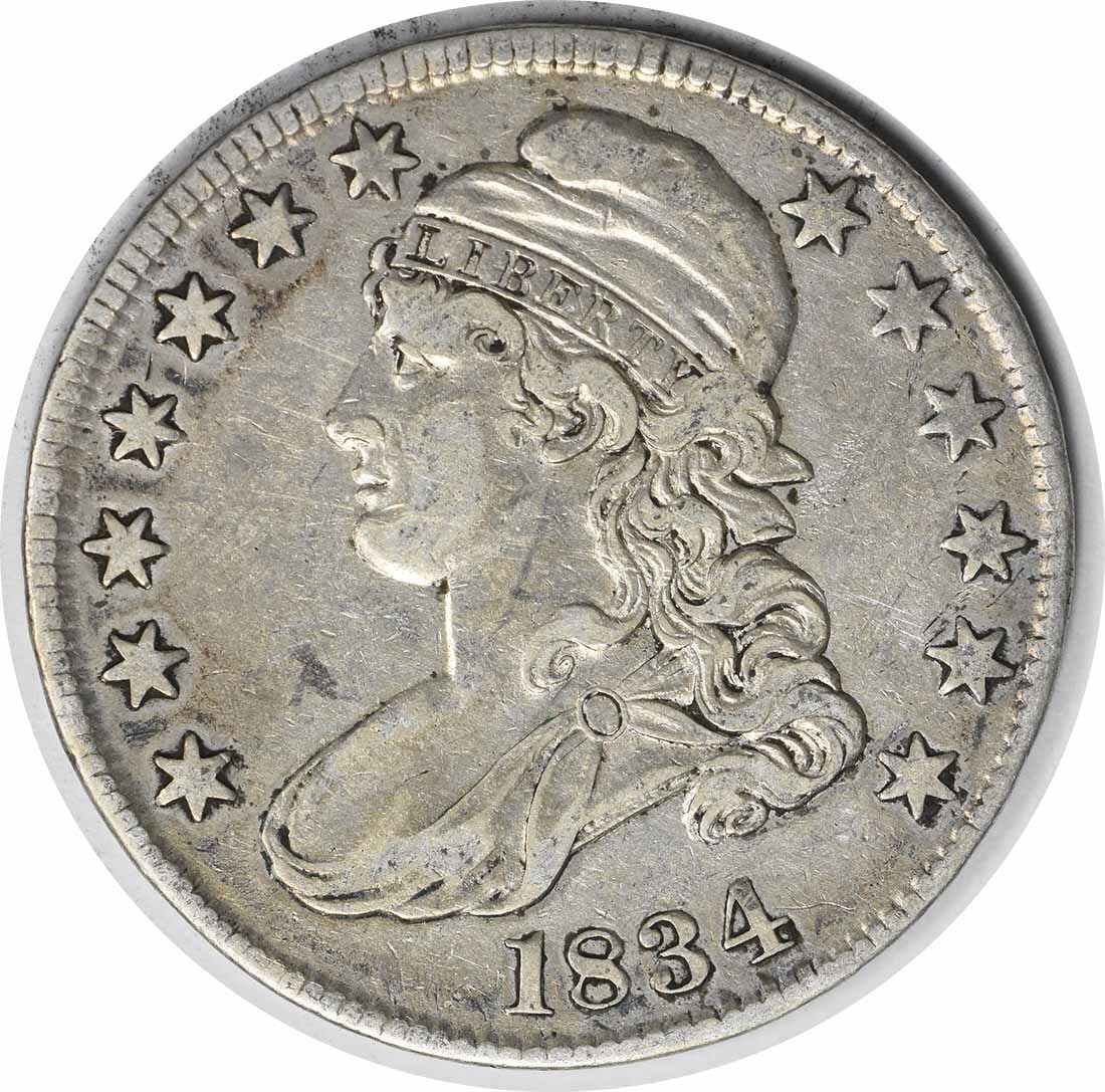 1834 Bust Half Dollar Large Date Small Letters 50C John Reich Design: 1834 Bust Half Dollar Large Date Small Letters 50C John Reich Design This 1834 Bust Half Dollar features a large date and small letters, showcasing the artistry of designer John Reich. Struck in Phila